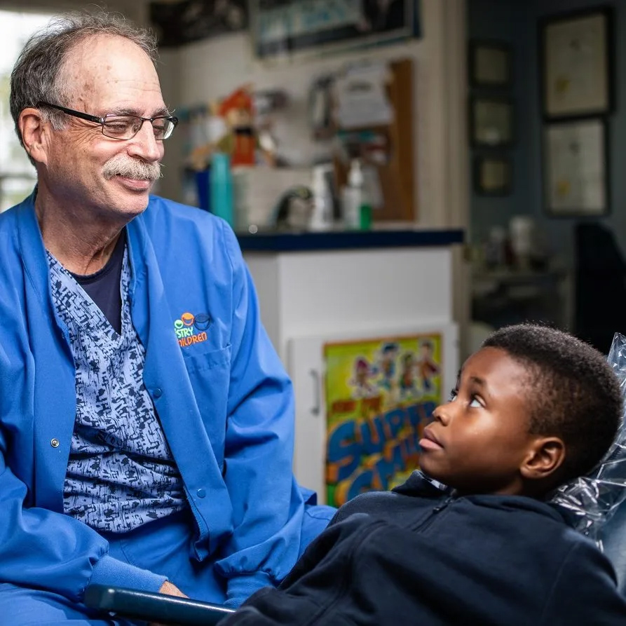 Dr. James P. Goldsmith with a patient